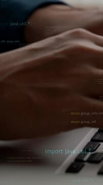 Computer programmer uses capable laptop computer to develop programming code of new software . Computer specialist working on future coding application for software programming development .