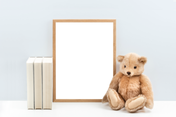 minimalist nursery art mockup with blank wooden picture frame and a vintage teddy bear / children's toy and books  on a white shelf or desk against a light blue wall, simply insert your artwork