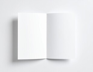 Fototapeta premium mockup of a folded brochure on a white surface, top-down view