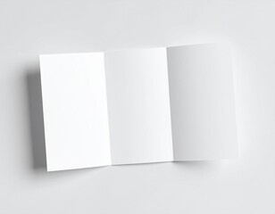 Fototapeta premium mockup of a folded brochure on a white surface, top-down view