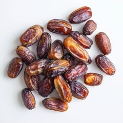 Whole date palm fruit on white background