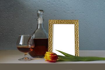 photo frame on the table with a tulip