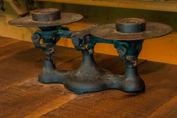 An antique iron weighing scale