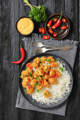 panko-breaded chicken bites with rice and sauce
