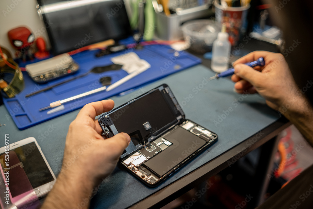 Poster Technician Repairing Smartphone Screen in Workshop While Using Tools and Components to Ensure Device Functionality
