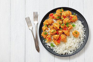 panko-breaded chicken bites with rice and sauce