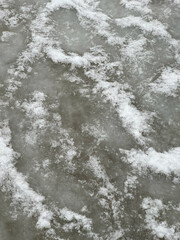 Frosted ice surface in natural style, gray and white textures, representing seasonal change and freezing patterns