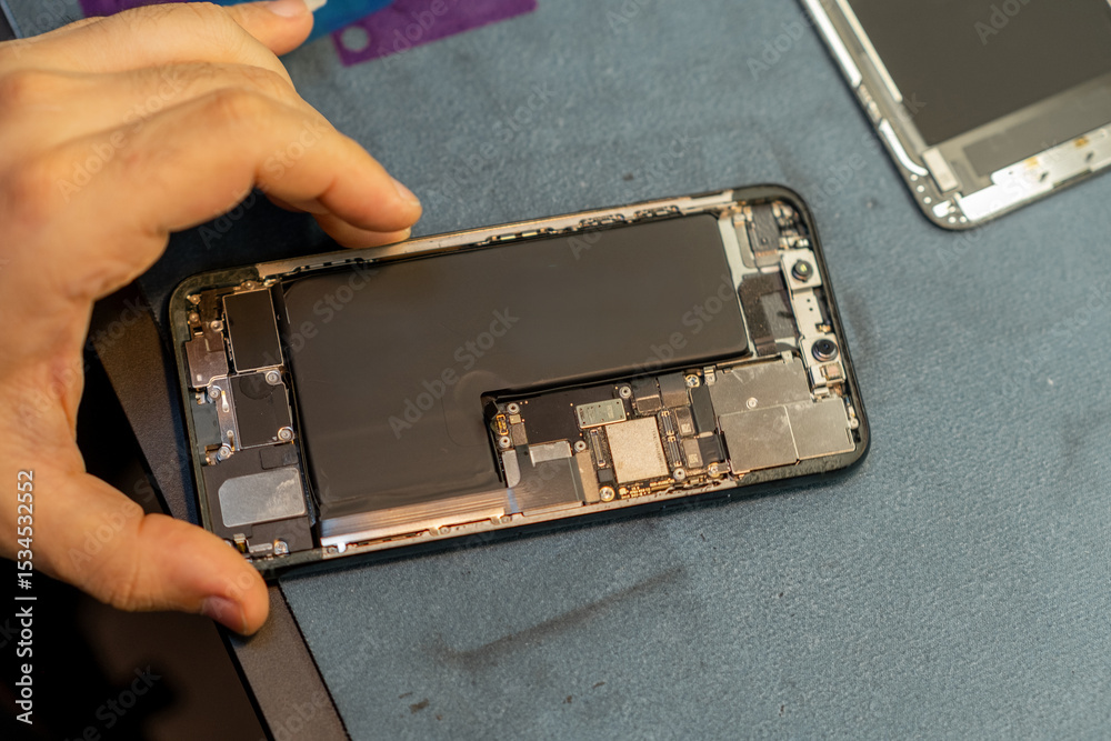 Aufkleber Phone Repair Technician Working on a Disassembled Device in a Workshop Setting During Daylight Hours