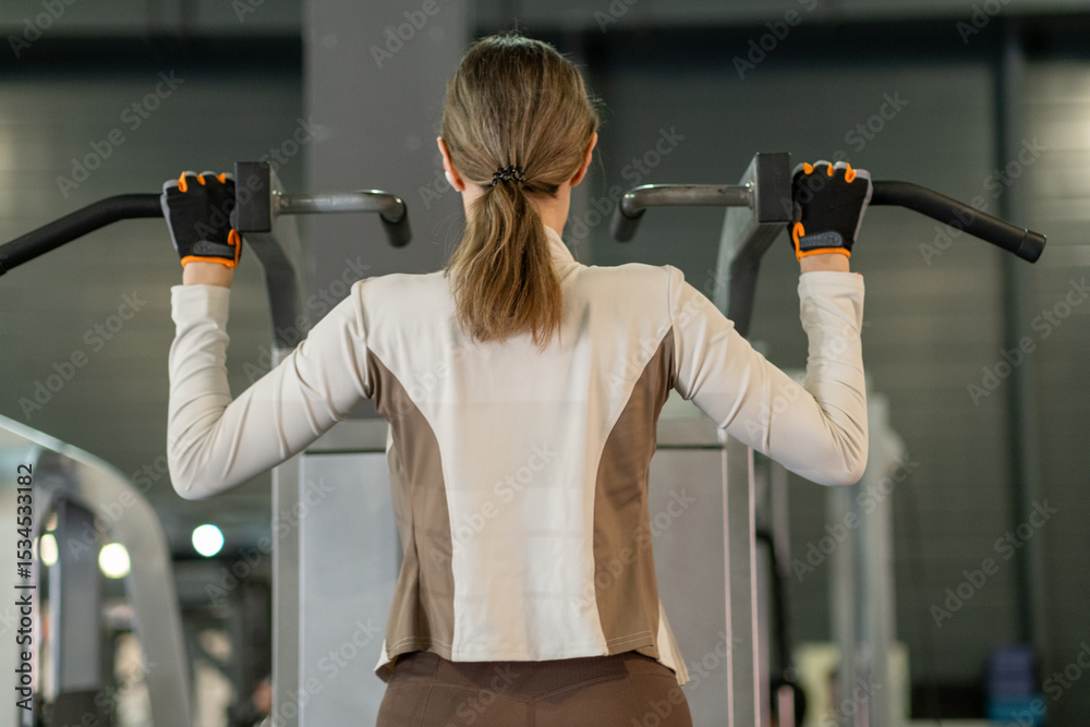 Poster strength training session in modern gym showcasing exercise technique and focus