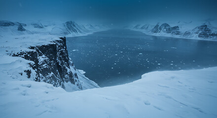 Obraz premium Snowy Cliffside Over Icy Fjord at Twilight