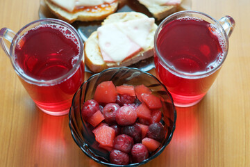 Refreshing summer snacks with drinks and fruit under warm sunlight