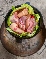 Preparing a dish in a cauldron - step by step.