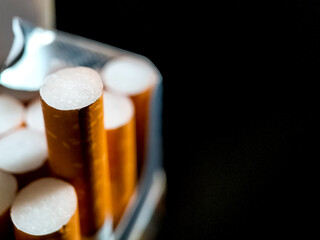 close up cigarette filters on dark background © asep