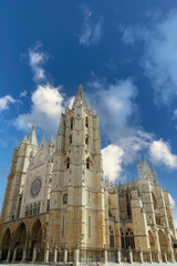 Fototapeta premium Leon cathedral, a stunning example of gothic architecture, rises majestically under a vibrant blue sky