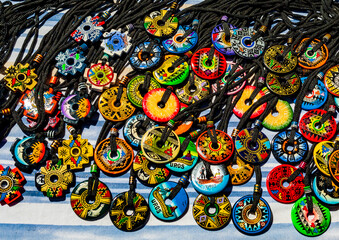 Handmade necklaces by the Uros indigenous people, displayed for sale on the floating islands of...