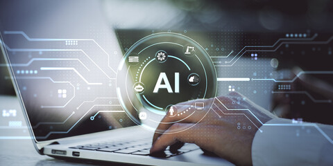 Artificial intelligence interface with futuristic digital symbols over laptop and hand, emphasizing machine learning and smart data integration.