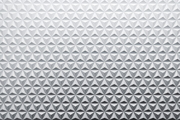 Fototapeta premium Geometric diamond-shaped triangle wall panels with abstract modern texture pattern in futuristic architectural design style background. 3D Rendering
