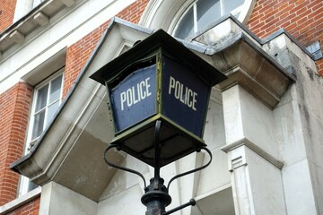 Classic Victorian Police lantern sign located outside the Police Station in North London, UK