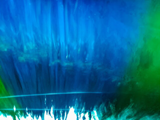 automatic car wash brush in action. A car goes through an automated car wash.