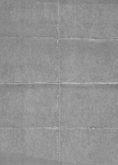 Fototapeta premium Gray Folded Paper Texture, Subtle Creased Surface with Natural Grain.