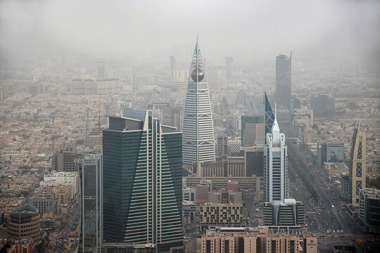 Aerial view of residential and commercial buildings in Riyadh, the capital city of Saudi Arabia. The image showcases modern urban development, Middle Eastern architecture, and city infrastructure