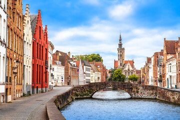 Bruges, Belgium.  Bruges Spiegelrei water canal and Kings Bridge, Brugge old town quarter