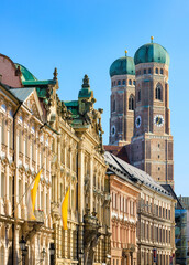 Fototapeta premium Historic European old town and city centre of Munich with a view of Frauenkirche also Munich Cathedral, the central church and tourist attraction of the Bavarian capital - Munich, Germany