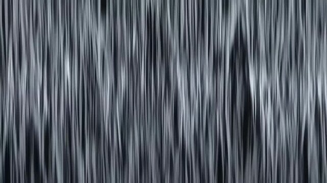 Abstract blurred lines create a sense of movement, rhythm, and an artistic feeling in a monochromatic gray scale background.