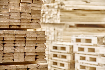 Freshly cut lumber planks stacked and ready for construction, wood, building, materials, industry