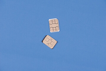 Two phone SIM cards, symbolizing international communication, dual SIM convenience, and staying...