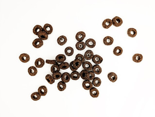 Unique arrangement of small round snacks on a plain background