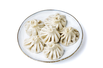 Plate with traditional georgian khinkali (dumplings) isolated on white background. Flat lay, copy space.
