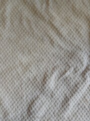 The checkered texture is dirty white. Cloth. Vertical shot