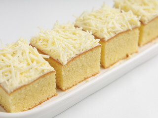 Vanilla sponge cheese cake on white background