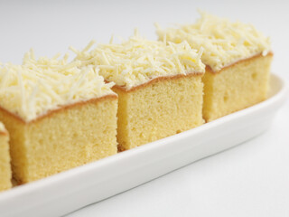 Vanilla sponge cheese cake on white background