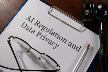 AI Regulation and Data Privacy Document on Desk with Gavel – Technology Law and Digital Ethics Concept