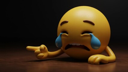 Sad Emoji 3D Render: A 3D rendered sad emoji with tears rolling down its face, lying on a dark wooden surface, pointing to the side with its finger.   - Powered by Adobe