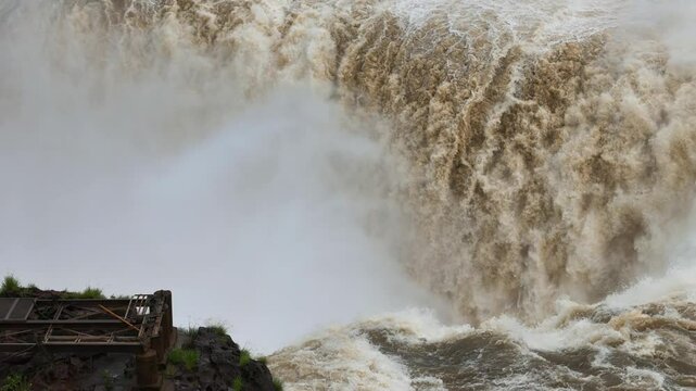 Ruined viewing platform near Devil's Throat as Iguazu Falls roars in the back