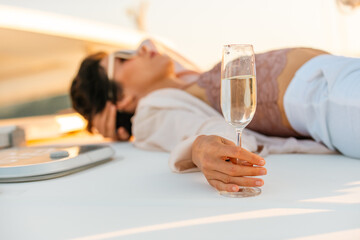 Beautiful Caucasian woman travel nature the sea on luxury catamaran boat yacht on summer beach...