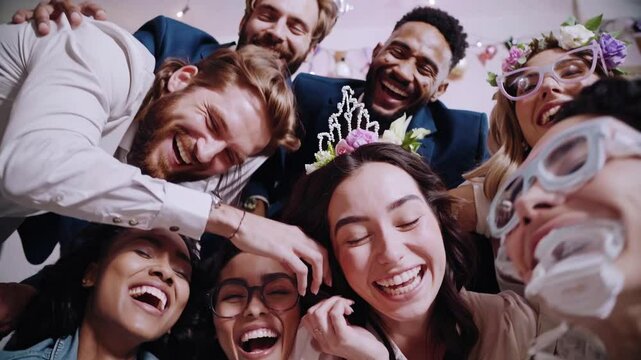 Friends Taking Spontaneous Selfie with Whimsical Wedding Props.

