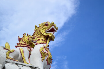 Statues of Lion Guarding temples, Symbols of Buddhism, Southeast Asia at Chiang Yuen temple, Mueang Chiang Mai, Chiang Mai, Northern Thailand