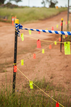 Tape and tags blocking off new road being built