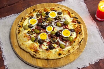 Original Brazilian pizza with olives, mushrooms, grated pepperoni, onion, red pepper, oregano and extra virgin olive oil