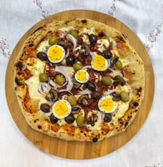 Original Brazilian pizza with olives, mushrooms, grated pepperoni, onion, red pepper, oregano and extra virgin olive oil