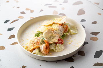 Fresh salad featuring succulent shrimp and vibrant vegetables topped with crunchy flakes creates a culinary delight. Perfect for a summer lunch gathering