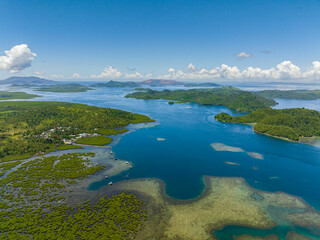 Beautiful lagoon inside the tropical island. Tinago Island. Mindanao, Philippines. Aerial view:...