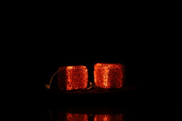 Glowing coals with glitch style lighting, enriched by noise, effect and grain details, create a...