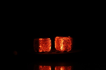 Glowing coals with glitch style lighting, enriched by noise, effect and grain details, create a...