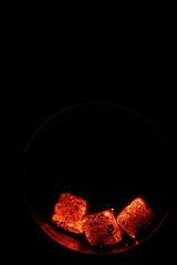 Glowing coals with glitch style lighting, enriched by noise, effect and grain details, create a mystical atmosphere in the dark. A vivid sense of heat and depth surrounds the image