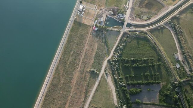 Reservoir dam wall, rural agricultural facilities and farmlands, Djizak region